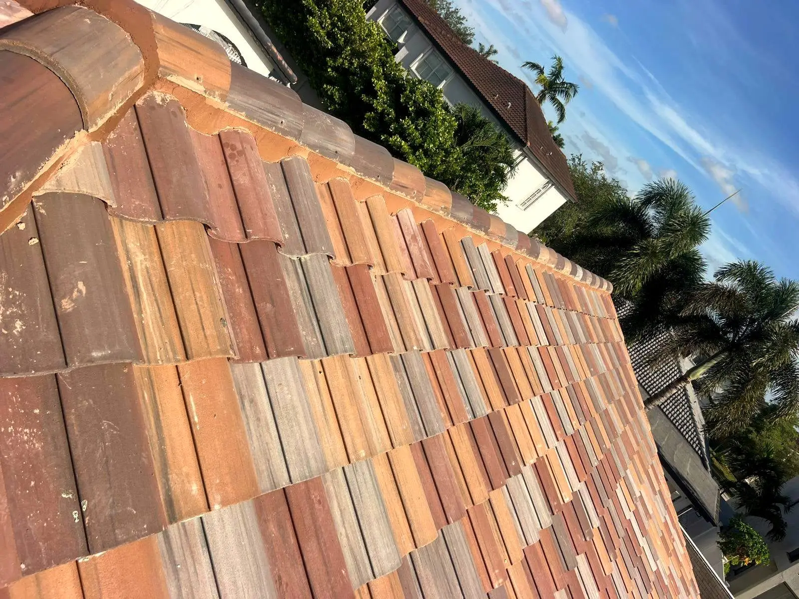 Clay barrel tile courses along a roof slope