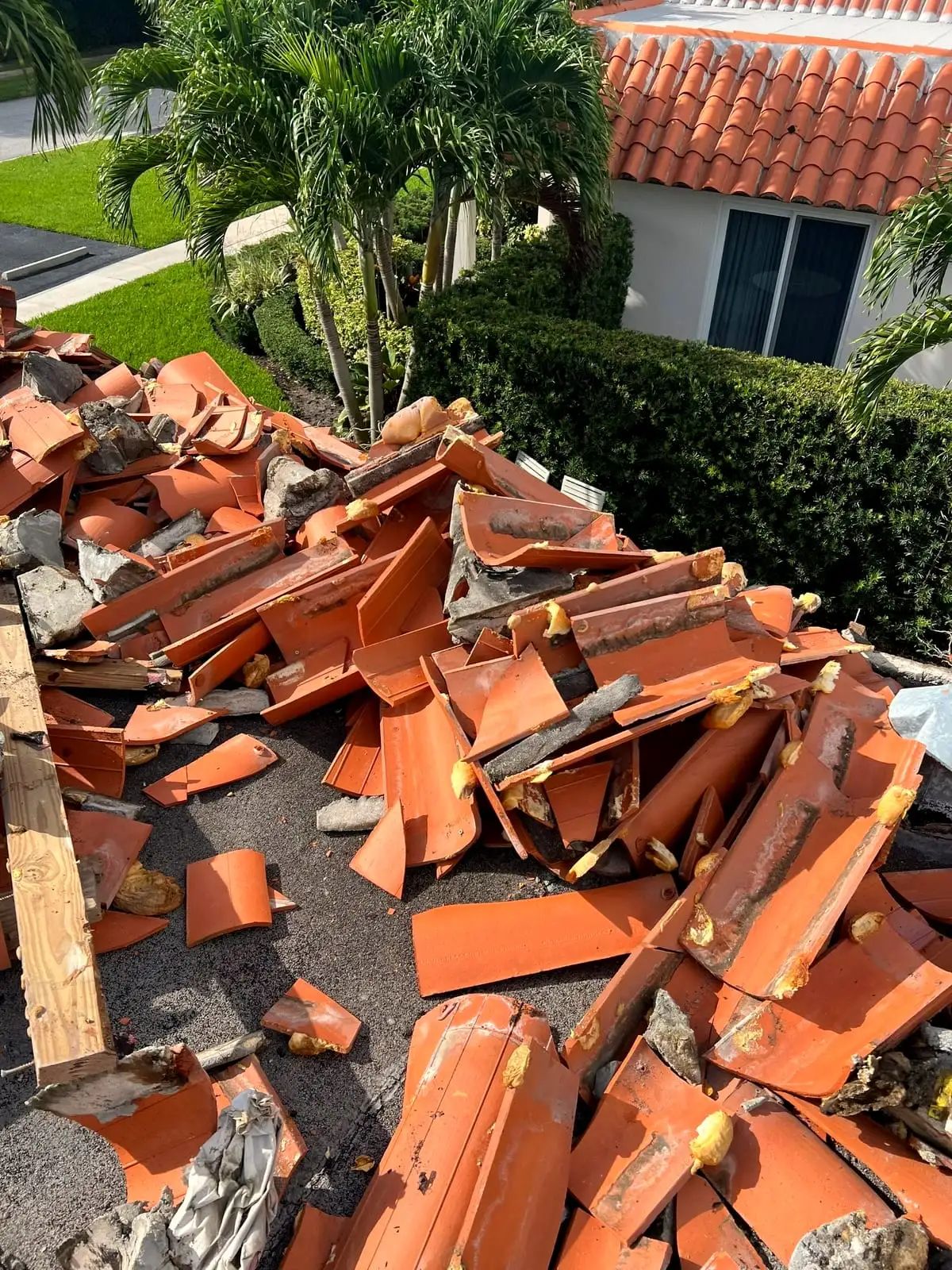 Old clay tile torn off a Boca Raton roof during a replacement